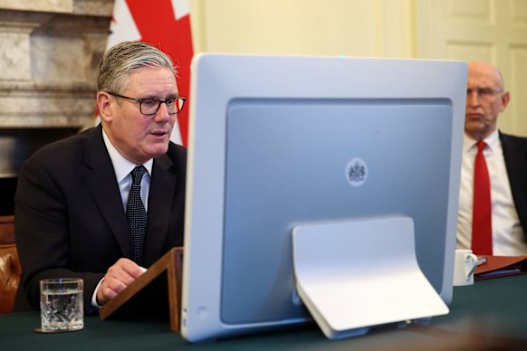 British Prime Minister Keir Starmer and Defence Secretary John Healey attend a meeting of the ‘coalition of the willing’ via video conference from 10 Downing Street  in London.