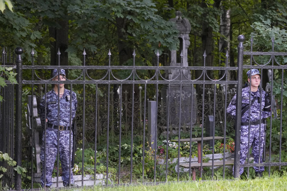 Russian Rosguardia (National Guard) servicemen guard the Porokhovskoye cemetery after a memorial service for mercenary chief Yevgeny Prigozhin, who was killed in a plane crash last week, in St. Petersburg.