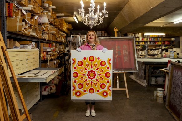 CEO of the Australian Design Museum Margaux Everett with a sample of Florence Broadhurst’s design ‘Solar’ which will be projected at Customs House as part Vivid’s Inside Out event.