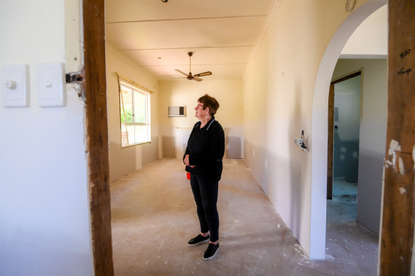 Glenys Mulcahy back inside her home, which remains under repair.