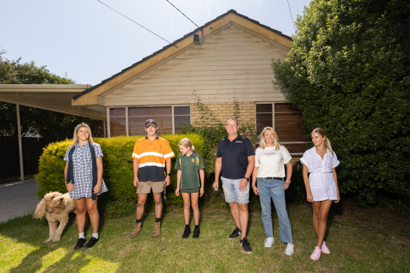 Corey and Kelly Wilkes with their children Harvey, Kurtis, Alexie and Tilly in front of the home they bought in Keilor village. 