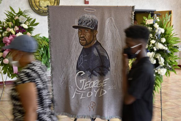 People pay their respects during a memorial service for George Floyd in North Carolina.