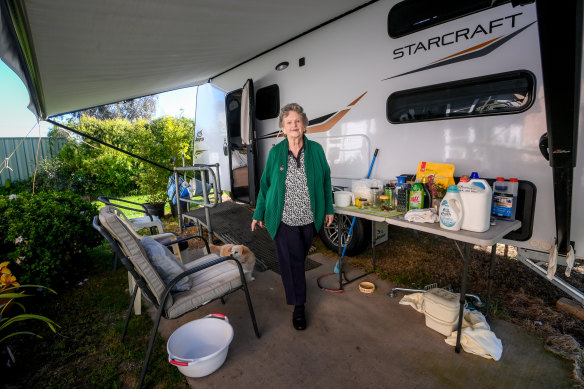 Lorraine Wilson at her caravan with dog Rae. 