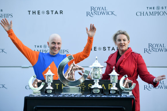 Jockey James Innes and trainer Wendy Roche celebrate at the trophy presentation for Nettoyer's victory.