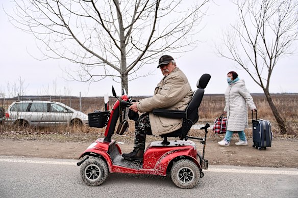 A man travels to a refreshment point run by local volunteers after crossing the border from Ukraine into Hungary, near Beregsurany. The Hungarian government has extended legal protection to those fleeing the Russian invasion.