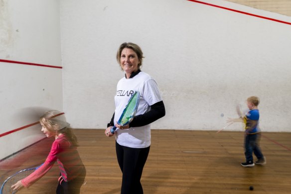 Former world champion Michelle Martin with junior players at North Manly Squash.