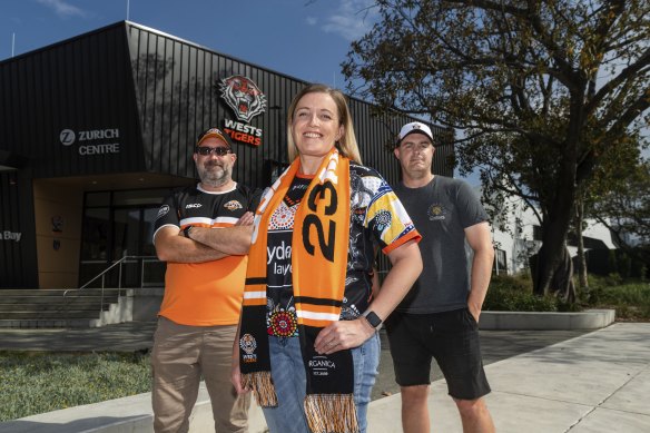 Joel Helmes (left) with fellow Wests Tigers fans and podcasters Kelly Hollis and Eddie Otto.