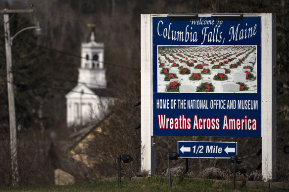 A sign welcomes visitors to Columbia Falls, Maine 