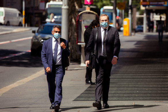 Michael Toohey, right, arriving at ICAC on Monday.