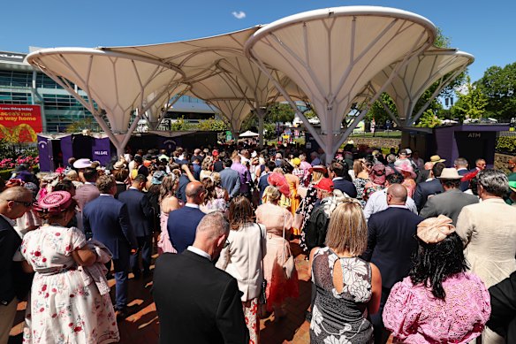Crowds queue outside the Flemington gates.