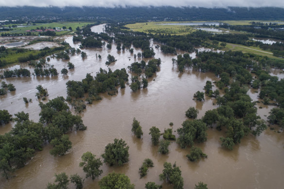 The swollen Nepean River near North Penrith on Tuesday. Concerns about what quality have prompted authorities to ramp up production from Sydney’s desalination plant.