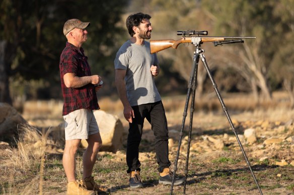 Mobile butcher Russell Barnes and Age journalist Benjamin Preiss hunting rabbits.