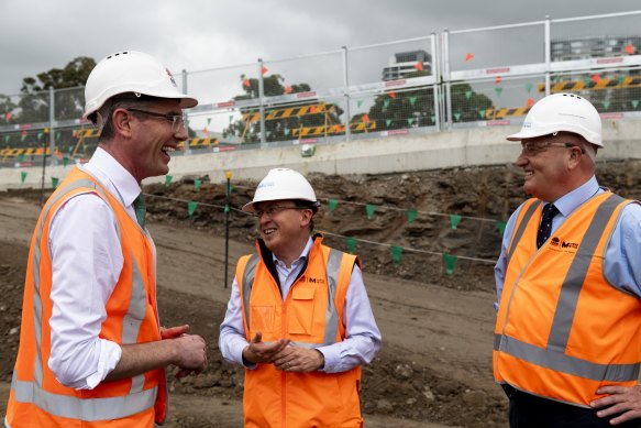 Sydney Metro chief executive Peter Regan, centre, at a metro rail site with Premier Dominic Perrottet, left, and Transport Minister David Elliott late last year.