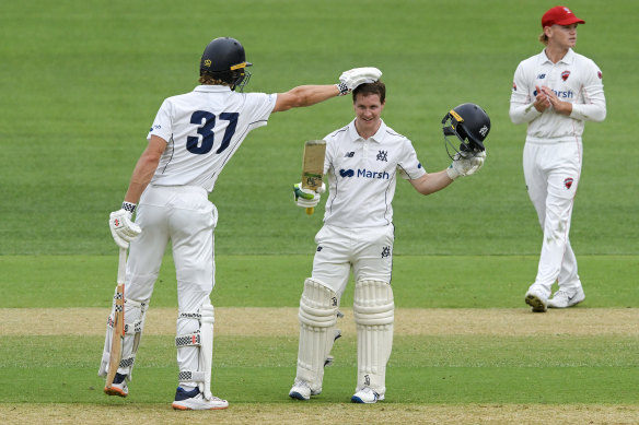 Campbell Kellaway congratulates Sam Harper on his stunning century.