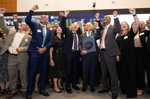 A crowd of franchisees, advisors, family and friends and employees cheered at the bell-ringing ceremony on Thursday.