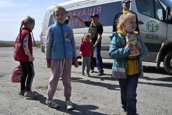 Children wait to be evacuated on a road near Slovyansk, eastern Ukraine in May.
