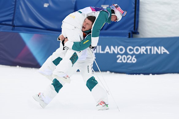Gold medallist Cooper Woods of Team Australia celebrates with teammate Matt Graham.