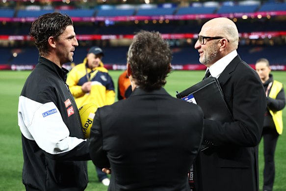 Scott Pendlebury with Magpies president Barry Carp and CEO Craig Kelly.