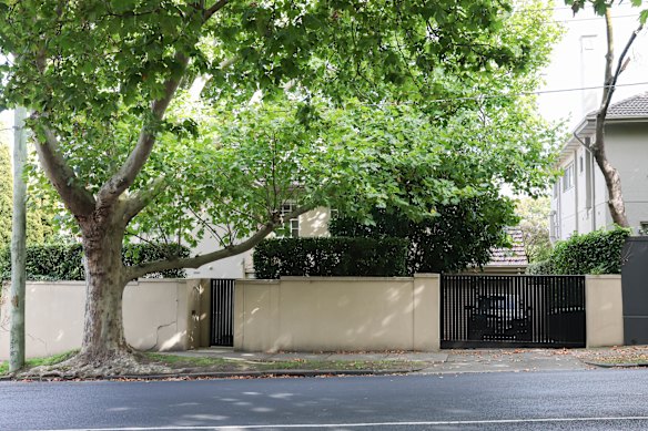 The Toorak property split in two is divided by more than common walls and hedges.
