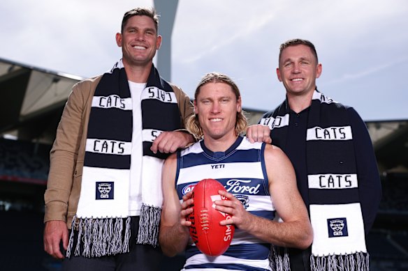 Geelong’s games record holder Tom Hawkins and 355-gamer Joel Selwood with their former teammate Mark Blicavs ahead of his 300th game.