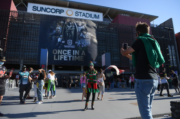 Fans enter Suncorp Stadium for the 2021 grand final.