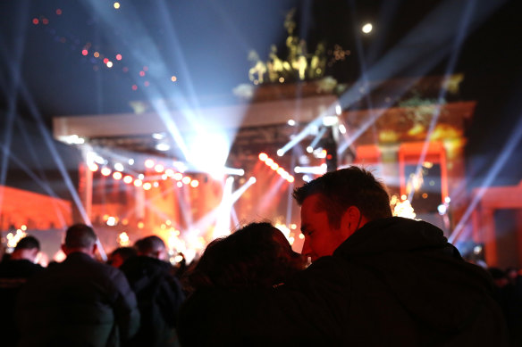 Visitors celebrate the new year at the Brandenburg Gate on January 1, 2023 in Berlin, Germany. For the past two years amid the COVID-19 pandemic, there was a national ban on purchasing and setting off fireworks in the country.