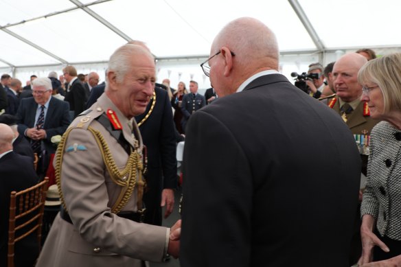 The King shakes hands with Governor-General David Hurley.