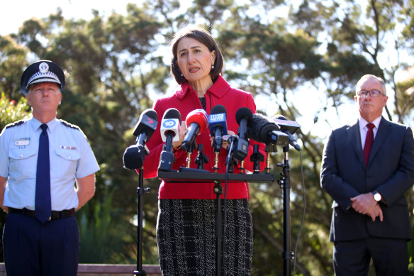 NSW Police Commissioner Mick Fuller with Premier Gladys Berejiklian and Health Minister Brad Hazzard on Monday.
