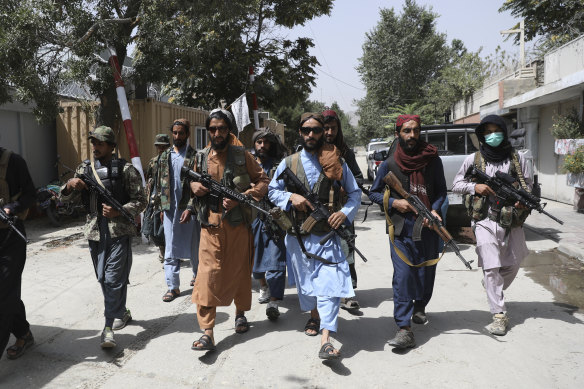 Taliban fighters patrol the city of Kabul. 