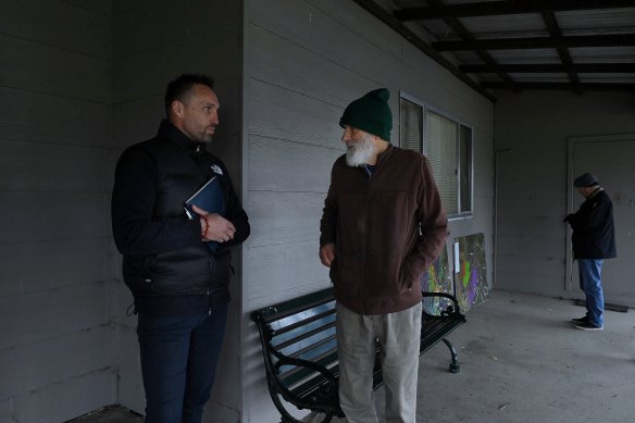 Wallaroo resident Ben Faulks (left) talking to a neighbour outside the public meeting in Murrumbateman.