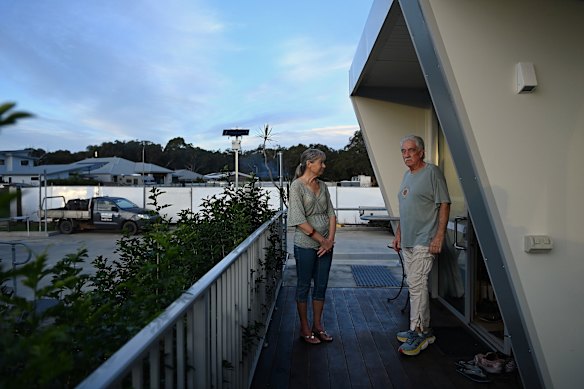 Residents and longtime friends Trish Bowie and Dirk Skelton outside a Bayside village pod at Brunswick Heads. The village will close in July.