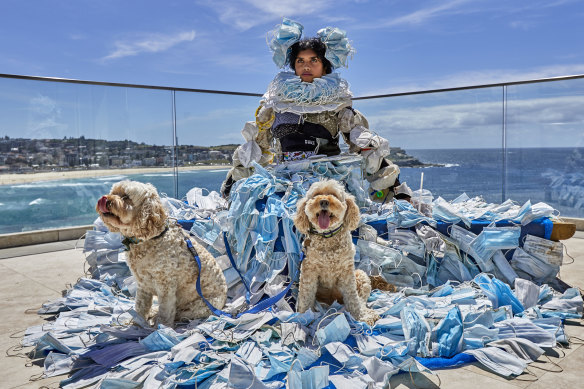 Ayanthi De Silva models a wearable environmental artwork called “Pandemania” by artist Marina DeBris. 