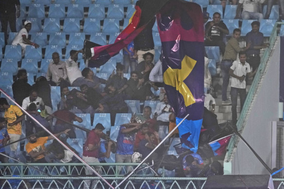 Strong winds saw stadium banners crash among spectators in Lucknow.