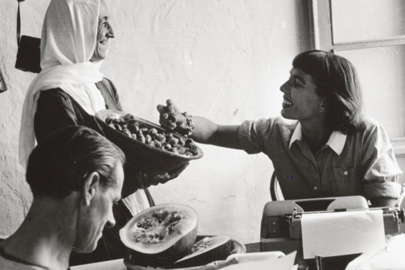 Charmian Clift, seated, with husband, fellow author George Johnston, and Kalymnian woman Sevasti Taktikou, who explained local women’s business to Clift.