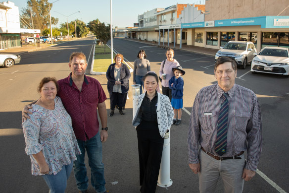 Biloela locals have rallied around the Murugappan family. They include (at front, left to right) Marie and Jeff Austin, Rita Twomey, Banana Shire Mayor Nev Ferrier, and (at back) Laraine Webster, Jayne Centurion, and Sarah and Eloise Broadley.