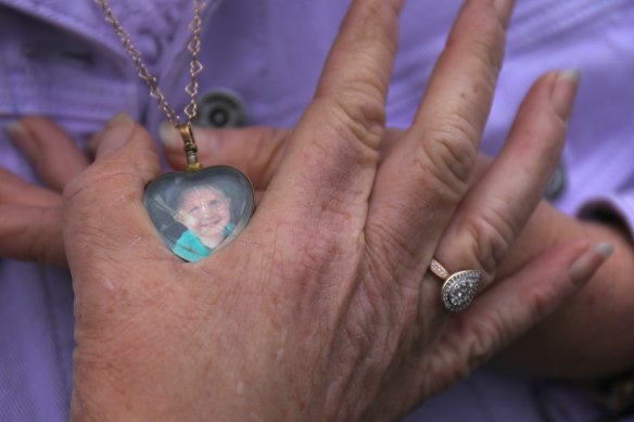Ruth Pendergast holding the locket containing a lock of her grandson Baylen’s hair.