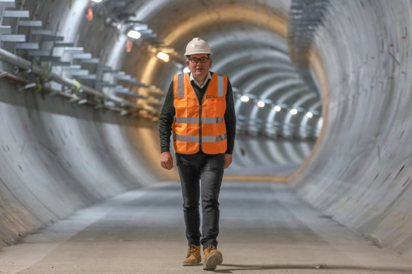 Premier Daniel Andrews starts his first day back at work in hi-vis and a helmet as he walks through the Metro Tunnel project.