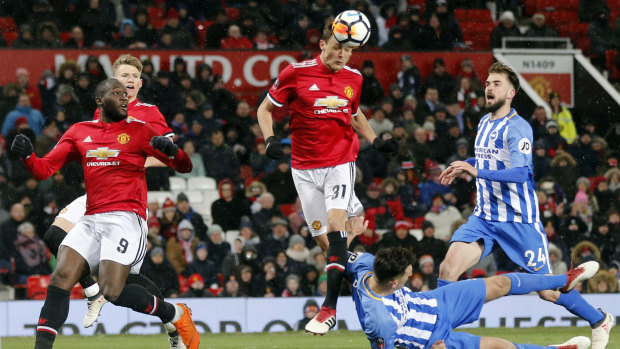 Heads up: Manchester United's Nemanja Matic heads the ball to score his side's second goal.