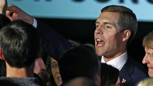 Conor Lamb celebrates with his supporters at his election night party.