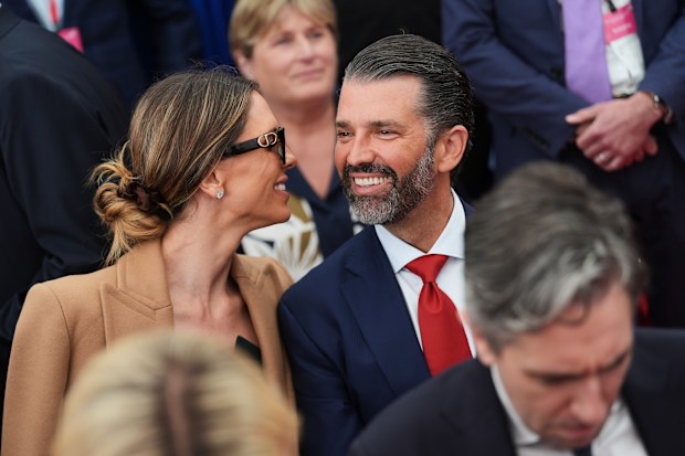 Donald Trump Jr, centre, speaks with his wife Bettina, left, as they wait for U.S. President Donald Trump to deliver remarks to U.S. embassy staff at Deerfield Residence in Dublin, Saturday, Sept. 12, 2026