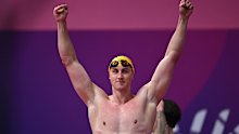 Cam McEvoy celebrates his gold in the 50m freestyle.