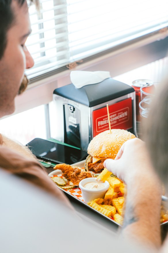 Fried chicken burger and chips. 