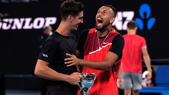 Nick Kyrgios, right, and Thanasi Kokkinakis, left, of Australia celebrate after defeating compatriots Matthew Ebden and Max Purcell in the men’s doubles final at the Australian Open tennis championships in Saturday, Jan. 29, 2022, in Melbourne, Australia. (AP Photo/Simon Baker)