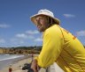 Lifeguard Mark Scotland scans the surf at Torquay.