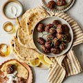 Beef koftas with pita bread and minted yoghurt.