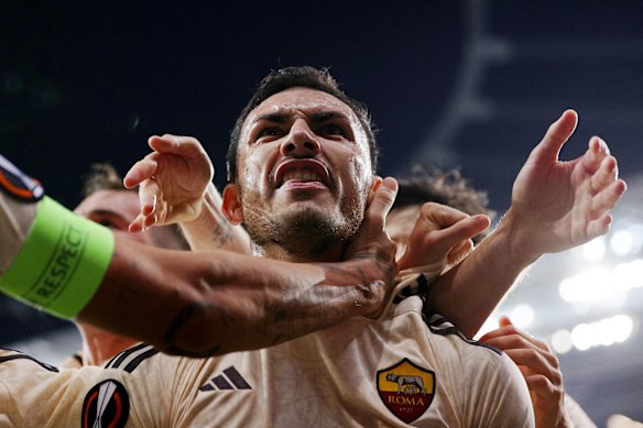 Leandro Paredes celebrates with teammates after scoring his team’s second goal from the penalty-spot during the UEFA Europa League 2023/24 Semi-Final second leg match between Bayer 04 Leverkusen and AS Roma at BayArena in Leverkusen, Germany.