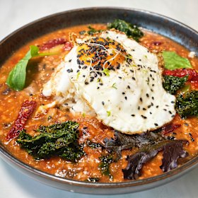 Yunnanese pork “bolognese” on rice, topped with a fried egg.