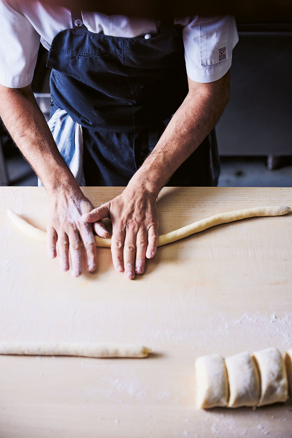 Step 8. Roll each ball on a lightly floured surface to form a log.