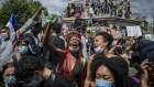 Protesters stand on the monument in Place de la Rebublique in Paris, part of the global movement triggered by George Floyd's death in the US. 