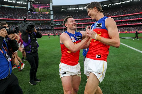 Lachie Neale and Eric Hipwood celebrate.